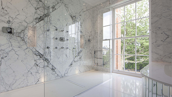 CCL wet room drain linear system integrated into tiled floor.
