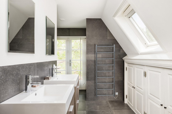 Polished stainless steel towel warmers from JIS combine style with durability.